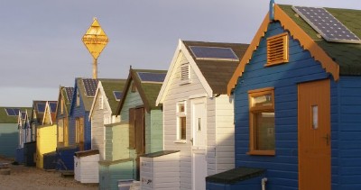 Solar panels on beach huts at Mudeford Spit (courtesy Wikimedia)